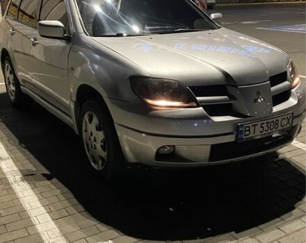 Серый Мицубиси Аутлендер, объемом двигателя 2.4 л и пробегом 285 тыс. км за 4600 $, фото 1 на Automoto.ua