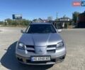 Серый Мицубиси Аутлендер, объемом двигателя 2.35 л и пробегом 291 тыс. км за 5200 $, фото 1 на Automoto.ua