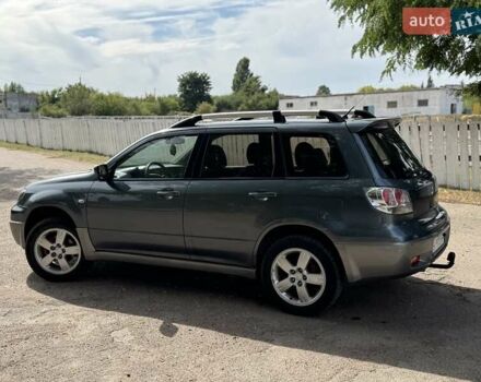 Серый Мицубиси Аутлендер, объемом двигателя 2.4 л и пробегом 276 тыс. км за 6299 $, фото 2 на Automoto.ua
