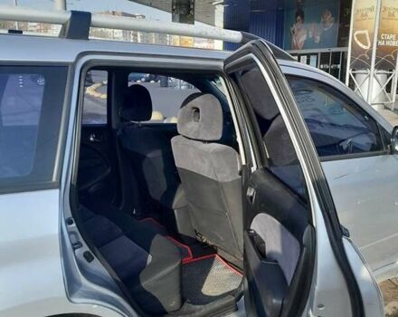 Серый Мицубиси Аутлендер, объемом двигателя 2 л и пробегом 320 тыс. км за 7300 $, фото 3 на Automoto.ua