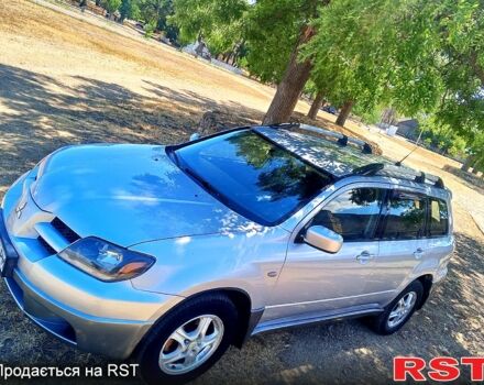 Серый Мицубиси Аутлендер, объемом двигателя 2.4 л и пробегом 270 тыс. км за 4999 $, фото 5 на Automoto.ua