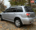 Серый Мицубиси Аутлендер, объемом двигателя 2 л и пробегом 239 тыс. км за 5800 $, фото 3 на Automoto.ua