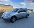 Серый Мицубиси Аутлендер, объемом двигателя 2 л и пробегом 220 тыс. км за 4550 $, фото 1 на Automoto.ua