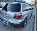 Серый Мицубиси Аутлендер, объемом двигателя 2 л и пробегом 220 тыс. км за 4550 $, фото 7 на Automoto.ua