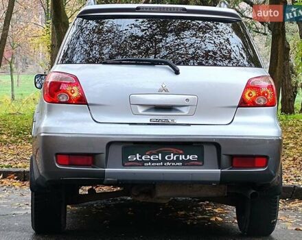 Серый Мицубиси Аутлендер, объемом двигателя 2.38 л и пробегом 266 тыс. км за 6399 $, фото 5 на Automoto.ua