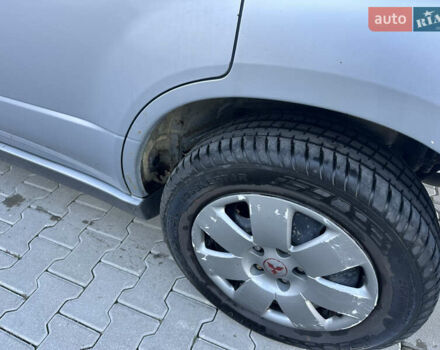 Серый Мицубиси Аутлендер, объемом двигателя 2 л и пробегом 220 тыс. км за 4550 $, фото 11 на Automoto.ua