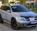 Сірий Міцубісі Аутлендер, об'ємом двигуна 2.4 л та пробігом 259 тис. км за 5999 $, фото 1 на Automoto.ua