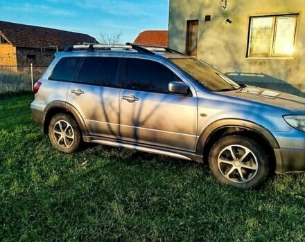 Серый Мицубиси Аутлендер, объемом двигателя 2.38 л и пробегом 295 тыс. км за 5500 $, фото 3 на Automoto.ua