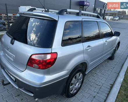 Серый Мицубиси Аутлендер, объемом двигателя 2 л и пробегом 220 тыс. км за 4550 $, фото 6 на Automoto.ua