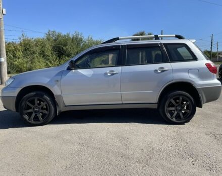 Серый Мицубиси Аутлендер, объемом двигателя 2 л и пробегом 225 тыс. км за 5999 $, фото 5 на Automoto.ua