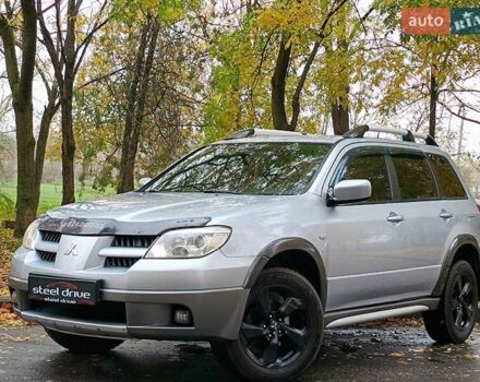 Серый Мицубиси Аутлендер, объемом двигателя 2.38 л и пробегом 266 тыс. км за 6399 $, фото 1 на Automoto.ua
