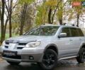 Серый Мицубиси Аутлендер, объемом двигателя 2.38 л и пробегом 266 тыс. км за 6399 $, фото 1 на Automoto.ua