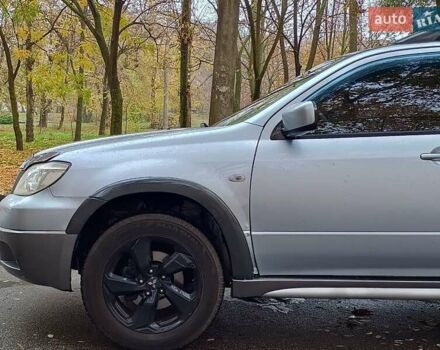Серый Мицубиси Аутлендер, объемом двигателя 2.38 л и пробегом 266 тыс. км за 6399 $, фото 2 на Automoto.ua