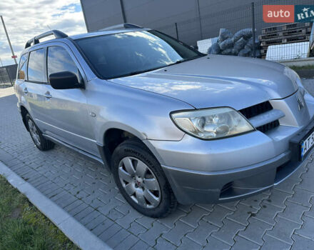 Серый Мицубиси Аутлендер, объемом двигателя 2 л и пробегом 220 тыс. км за 4550 $, фото 4 на Automoto.ua