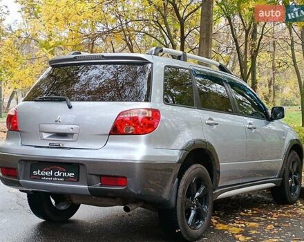Серый Мицубиси Аутлендер, объемом двигателя 2.38 л и пробегом 266 тыс. км за 6399 $, фото 6 на Automoto.ua