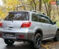 Серый Мицубиси Аутлендер, объемом двигателя 2.38 л и пробегом 266 тыс. км за 6399 $, фото 6 на Automoto.ua