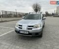 Серый Мицубиси Аутлендер, объемом двигателя 2.38 л и пробегом 246 тыс. км за 5500 $, фото 2 на Automoto.ua