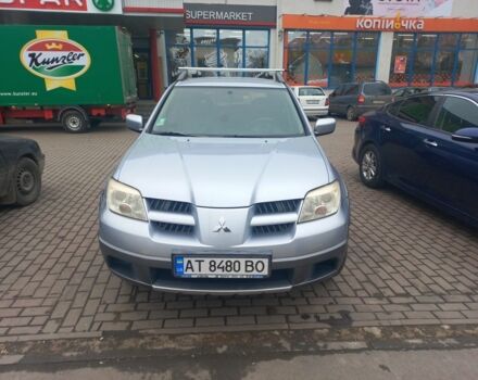 Серый Мицубиси Аутлендер, объемом двигателя 2.4 л и пробегом 246 тыс. км за 5500 $, фото 2 на Automoto.ua