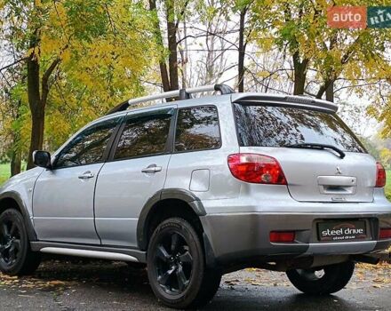 Серый Мицубиси Аутлендер, объемом двигателя 2.38 л и пробегом 266 тыс. км за 6399 $, фото 4 на Automoto.ua