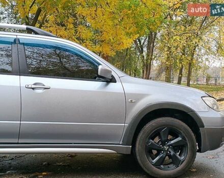 Серый Мицубиси Аутлендер, объемом двигателя 2.38 л и пробегом 266 тыс. км за 6399 $, фото 8 на Automoto.ua