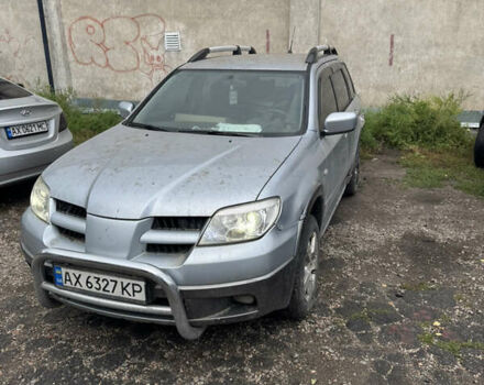 Серый Мицубиси Аутлендер, объемом двигателя 2.38 л и пробегом 309 тыс. км за 3500 $, фото 1 на Automoto.ua