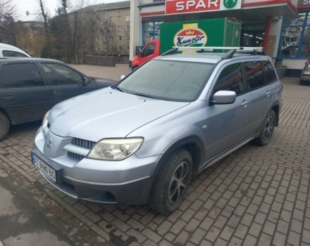Серый Мицубиси Аутлендер, объемом двигателя 2.4 л и пробегом 246 тыс. км за 5500 $, фото 1 на Automoto.ua