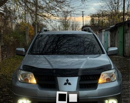 Серый Мицубиси Аутлендер, объемом двигателя 2.4 л и пробегом 282 тыс. км за 7500 $, фото 1 на Automoto.ua