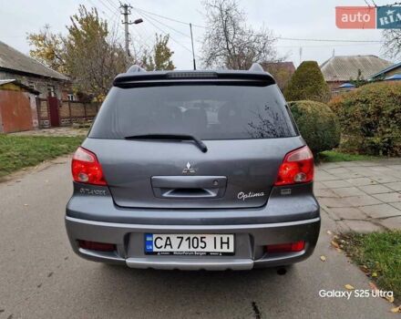 Серый Мицубиси Аутлендер, объемом двигателя 2 л и пробегом 240 тыс. км за 6300 $, фото 3 на Automoto.ua
