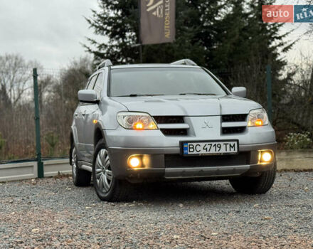 Серый Мицубиси Аутлендер, объемом двигателя 2.38 л и пробегом 204 тыс. км за 6990 $, фото 23 на Automoto.ua