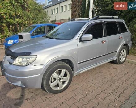 Серый Мицубиси Аутлендер, объемом двигателя 2.4 л и пробегом 243 тыс. км за 6999 $, фото 3 на Automoto.ua