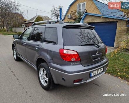Серый Мицубиси Аутлендер, объемом двигателя 2 л и пробегом 240 тыс. км за 6300 $, фото 6 на Automoto.ua