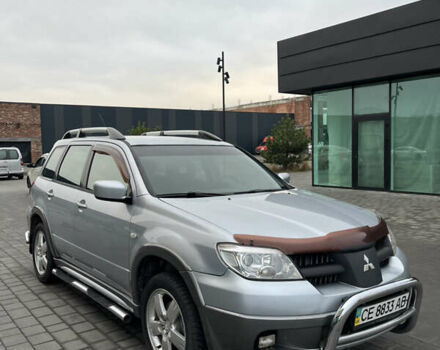 Серый Мицубиси Аутлендер, объемом двигателя 2.38 л и пробегом 180 тыс. км за 6000 $, фото 6 на Automoto.ua