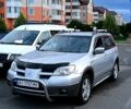 Сірий Міцубісі Аутлендер, об'ємом двигуна 2.4 л та пробігом 260 тис. км за 5250 $, фото 2 на Automoto.ua