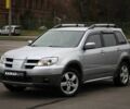 Серый Мицубиси Аутлендер, объемом двигателя 2.4 л и пробегом 171 тыс. км за 8200 $, фото 1 на Automoto.ua