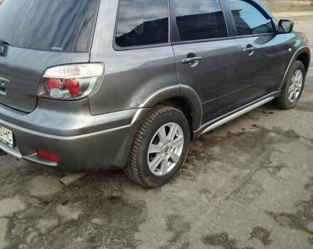 Серый Мицубиси Аутлендер, объемом двигателя 2 л и пробегом 154 тыс. км за 6500 $, фото 3 на Automoto.ua