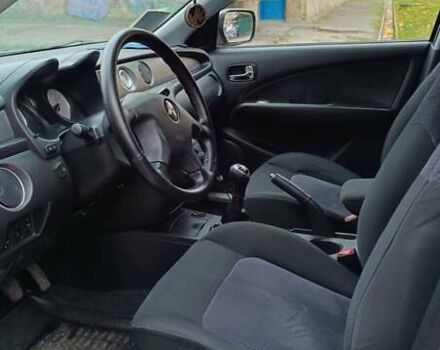 Сірий Міцубісі Аутлендер, об'ємом двигуна 2 л та пробігом 312 тис. км за 8300 $, фото 13 на Automoto.ua