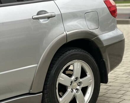 Сірий Міцубісі Аутлендер, об'ємом двигуна 2.4 л та пробігом 98 тис. км за 7199 $, фото 12 на Automoto.ua