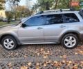 Серый Мицубиси Аутлендер, объемом двигателя 2.4 л и пробегом 186 тыс. км за 6350 $, фото 1 на Automoto.ua