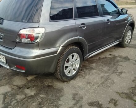 Серый Мицубиси Аутлендер, объемом двигателя 2 л и пробегом 154 тыс. км за 6500 $, фото 5 на Automoto.ua