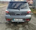 Серый Мицубиси Аутлендер, объемом двигателя 2 л и пробегом 154 тыс. км за 6500 $, фото 4 на Automoto.ua