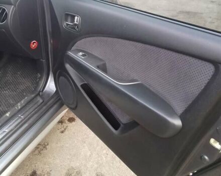 Серый Мицубиси Аутлендер, объемом двигателя 2 л и пробегом 154 тыс. км за 6500 $, фото 7 на Automoto.ua