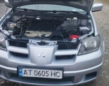 Серый Мицубиси Аутлендер, объемом двигателя 2.4 л и пробегом 261 тыс. км за 5700 $, фото 4 на Automoto.ua