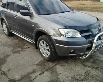 Серый Мицубиси Аутлендер, объемом двигателя 2 л и пробегом 154 тыс. км за 6500 $, фото 1 на Automoto.ua