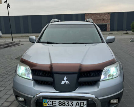 Серый Мицубиси Аутлендер, объемом двигателя 2.38 л и пробегом 180 тыс. км за 6000 $, фото 1 на Automoto.ua