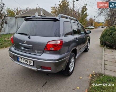 Серый Мицубиси Аутлендер, объемом двигателя 2 л и пробегом 240 тыс. км за 6300 $, фото 4 на Automoto.ua
