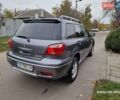 Серый Мицубиси Аутлендер, объемом двигателя 2 л и пробегом 240 тыс. км за 6300 $, фото 4 на Automoto.ua