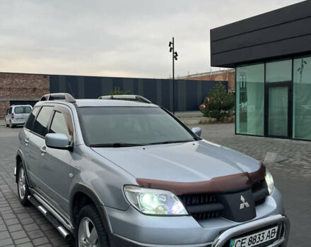 Серый Мицубиси Аутлендер, объемом двигателя 2.38 л и пробегом 180 тыс. км за 6000 $, фото 2 на Automoto.ua
