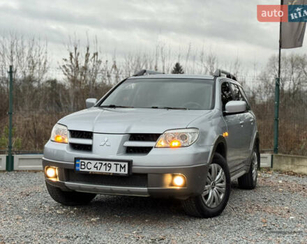 Серый Мицубиси Аутлендер, объемом двигателя 2.38 л и пробегом 204 тыс. км за 6990 $, фото 43 на Automoto.ua