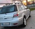 Серый Мицубиси Аутлендер, объемом двигателя 2.38 л и пробегом 228 тыс. км за 7900 $, фото 1 на Automoto.ua