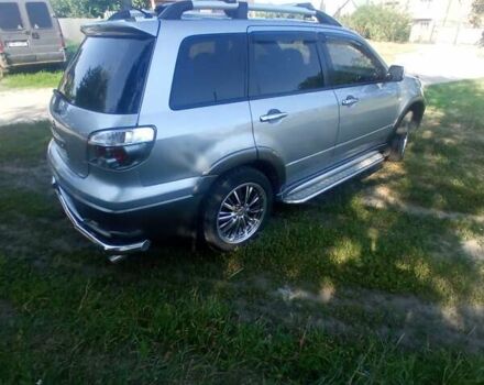 Сірий Міцубісі Аутлендер, об'ємом двигуна 2.38 л та пробігом 226 тис. км за 10000 $, фото 17 на Automoto.ua